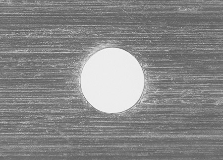 Microphotograph of a 0.2 mm pinhole.