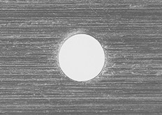 Microphotograph of a 0.2 mm pinhole.